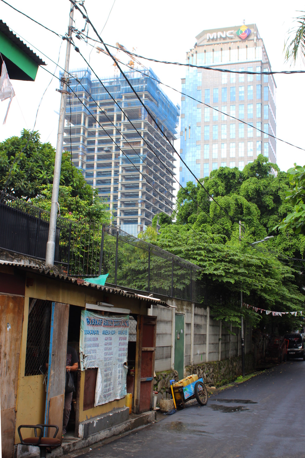 Jakarta buildings and a small house