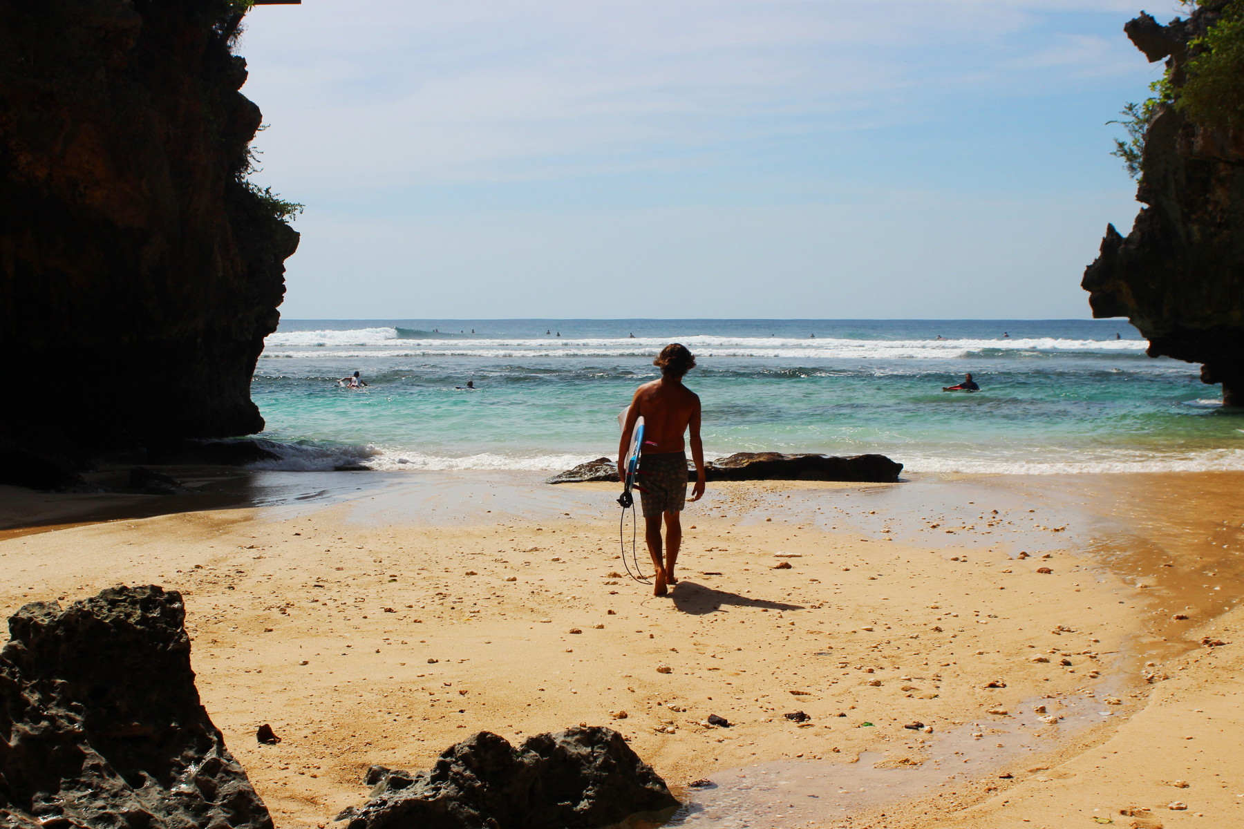 Surfer entering the sea