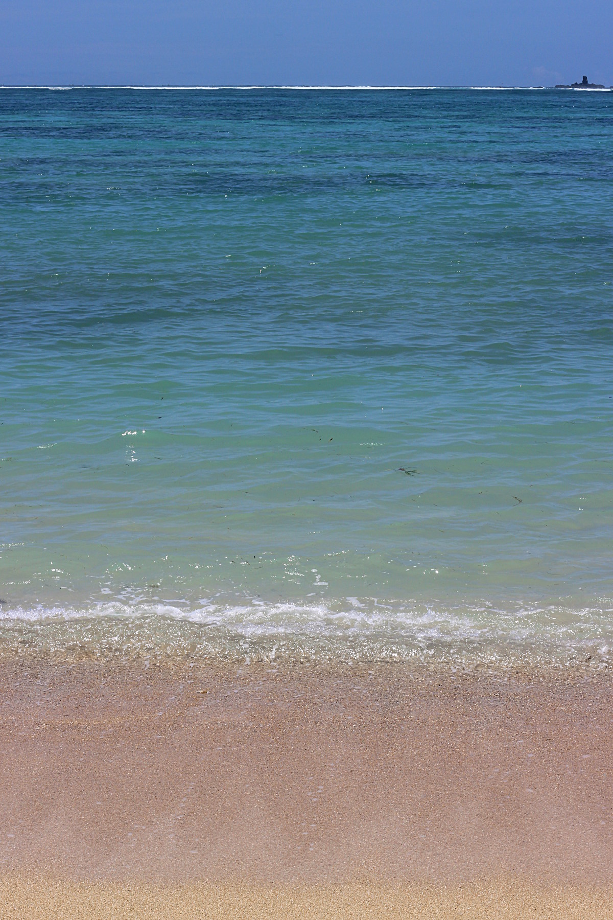 Pink sand and blue sea