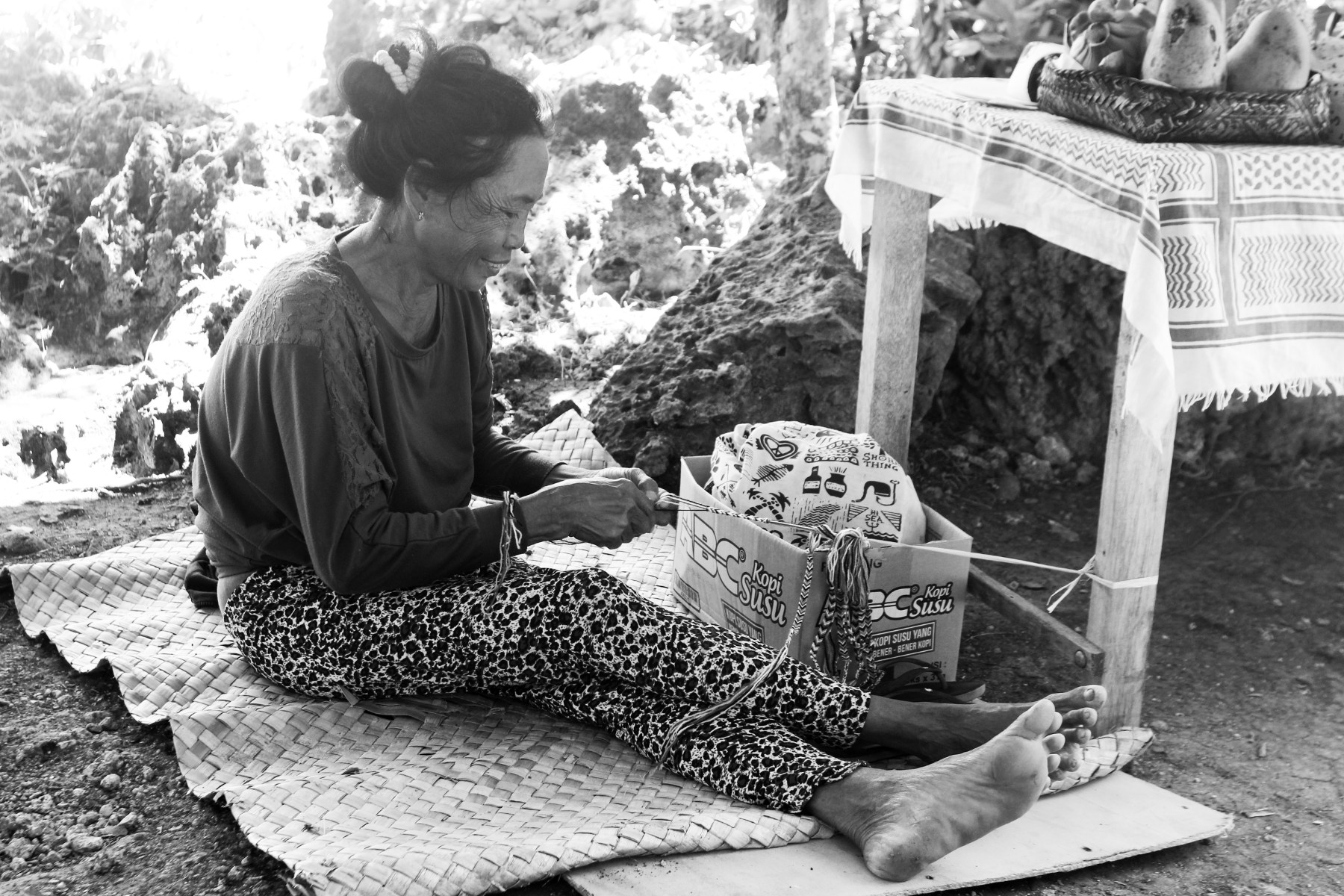 A girl making bracelet.